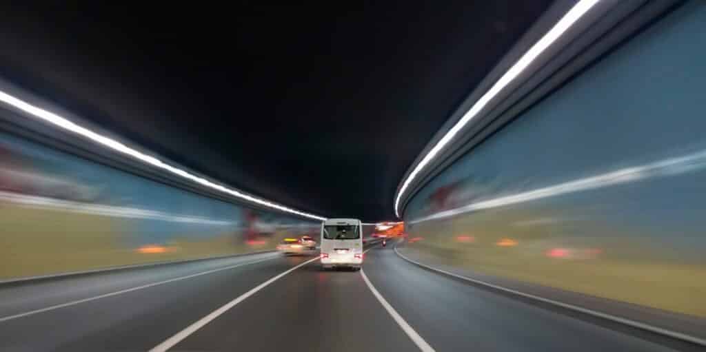 An image of cars coming through a tunnel at 50 mph+. What is shutter speed? 