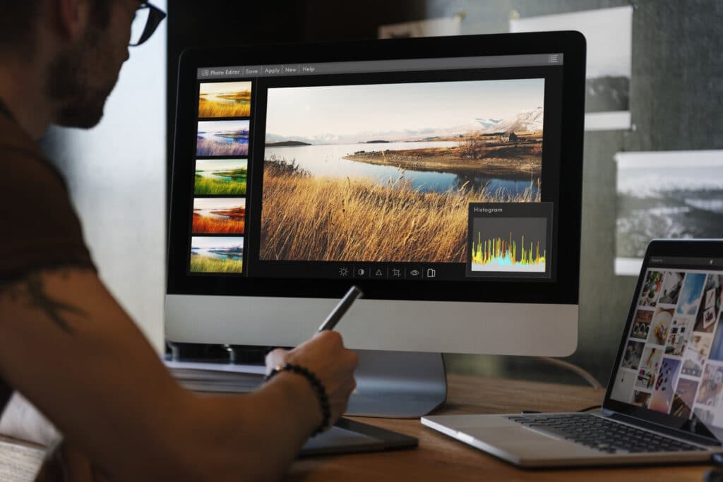 A student editing an image on a computer screen.