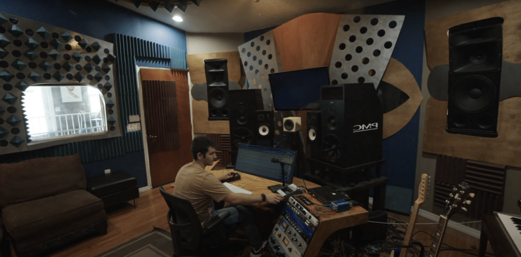 graduate working as an audio engineer in studio